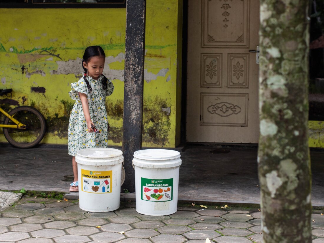 Photo: Project STOP girl with waste in Banyuwangi